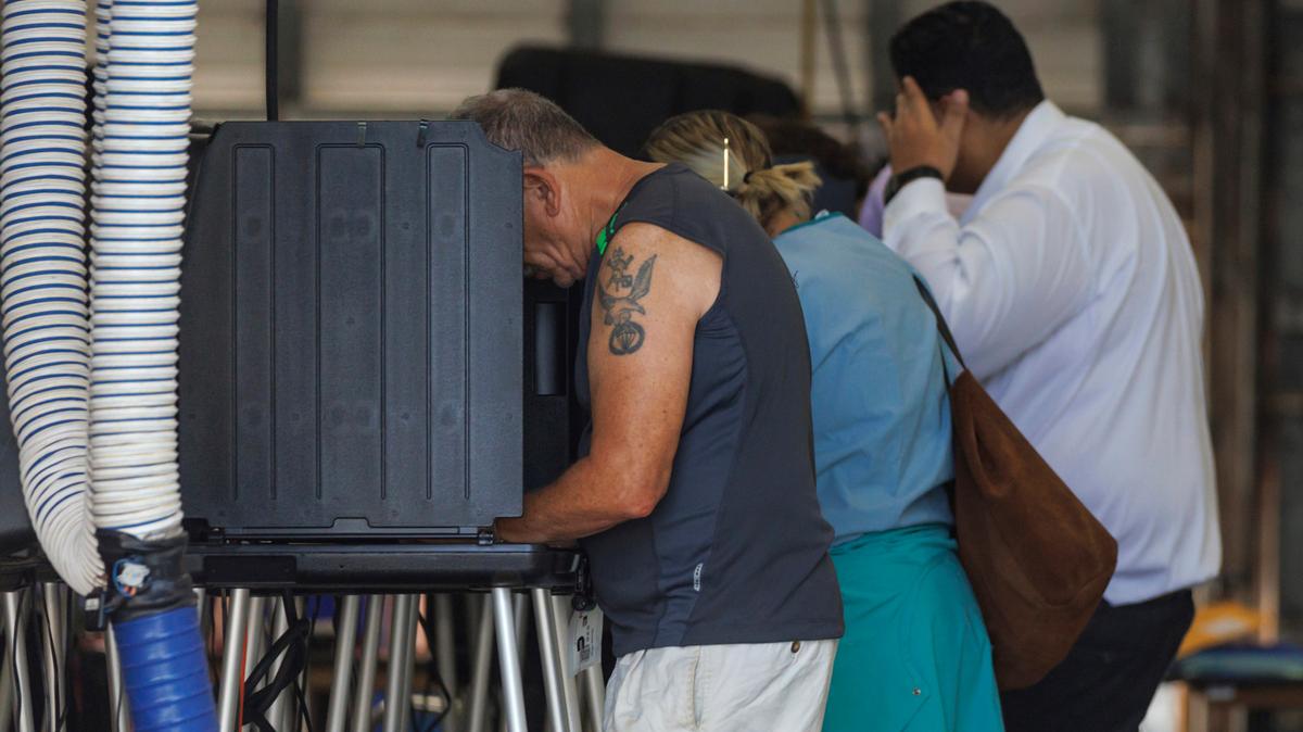 Voters casting ballots during the midterm elections in Miami-Dade County at the Miami Beach Fire Department, Station 3, on Nov. 8.