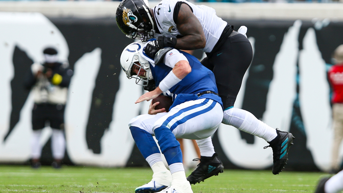 Jacksonville Jaguars linebacker Josh Allen (41) sacks Indianapolis Colts quarterback Matt Ryan (2) during the first half of an NFL football game, Sunday, Sept. 18, 2022, in Jacksonville, Fla. (AP Photo/Gary McCullough)