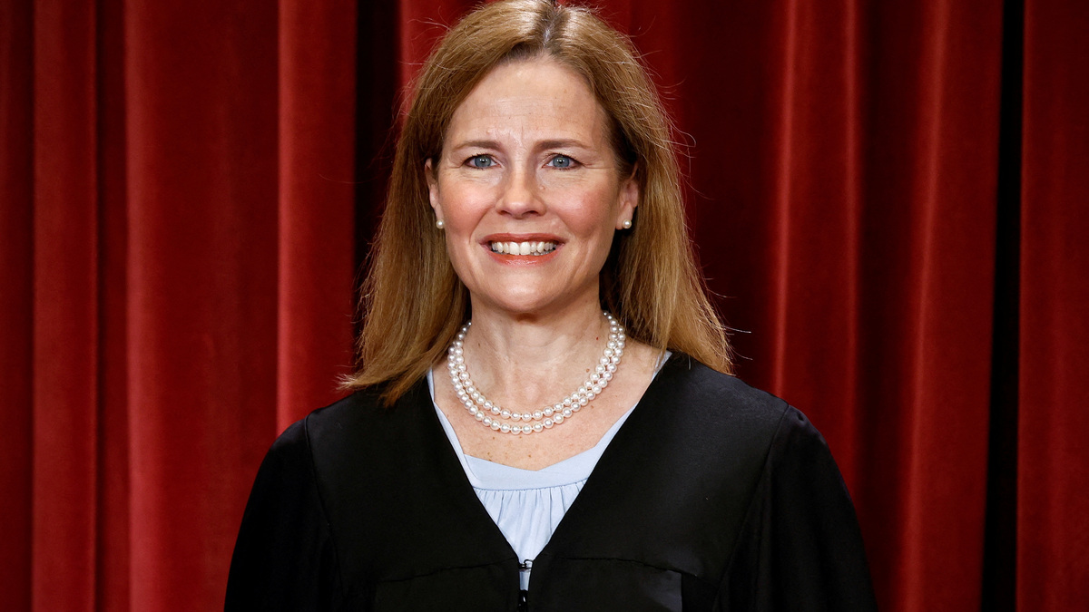 FILE PHOTO: U.S. Supreme Court Associate Justice Amy Coney Barrett poses during a group portrait at the Supreme Court in Washington, U.S., October 7, 2022. REUTERS/Evelyn Hockstein/File Photo