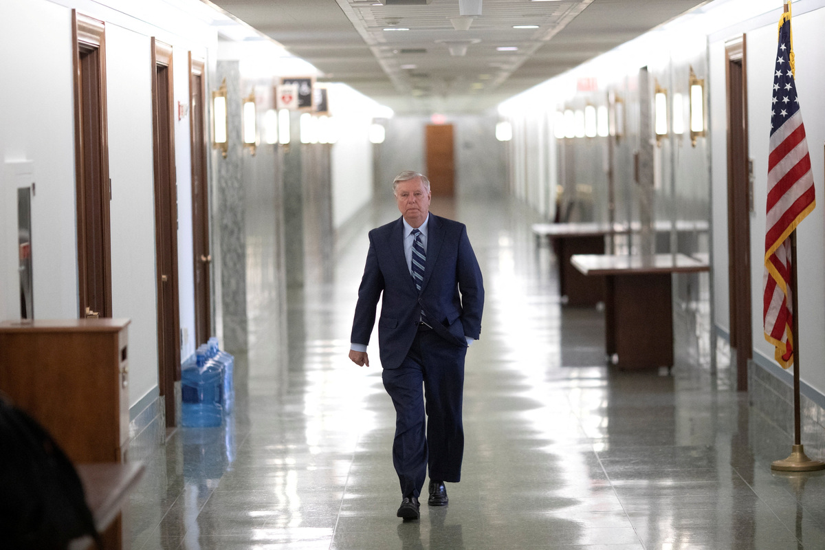 FILE PHOTO: U.S. Senator Lindsey Graham (R-S.C.) walks through the Dirksen Senate Office Building before Judiciary Committee hearing at the U.S. Capitol in Washington, U.S., April 27, 2022. REUTERS/Tom Brenner/File Photo