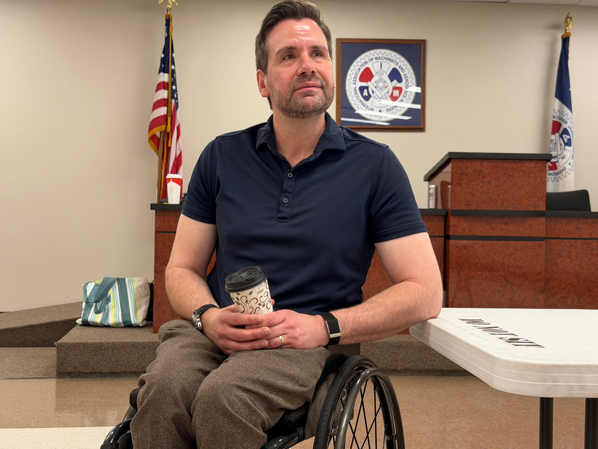 Josh Turek, the Democrat running for Iowa's open Senate sits after attending a roundtable discussion on healthcare in Des Moines, Iowa, U.S., June 22, 2026. Picture taken with a mobile phone. REUTERS/Nathan Layne