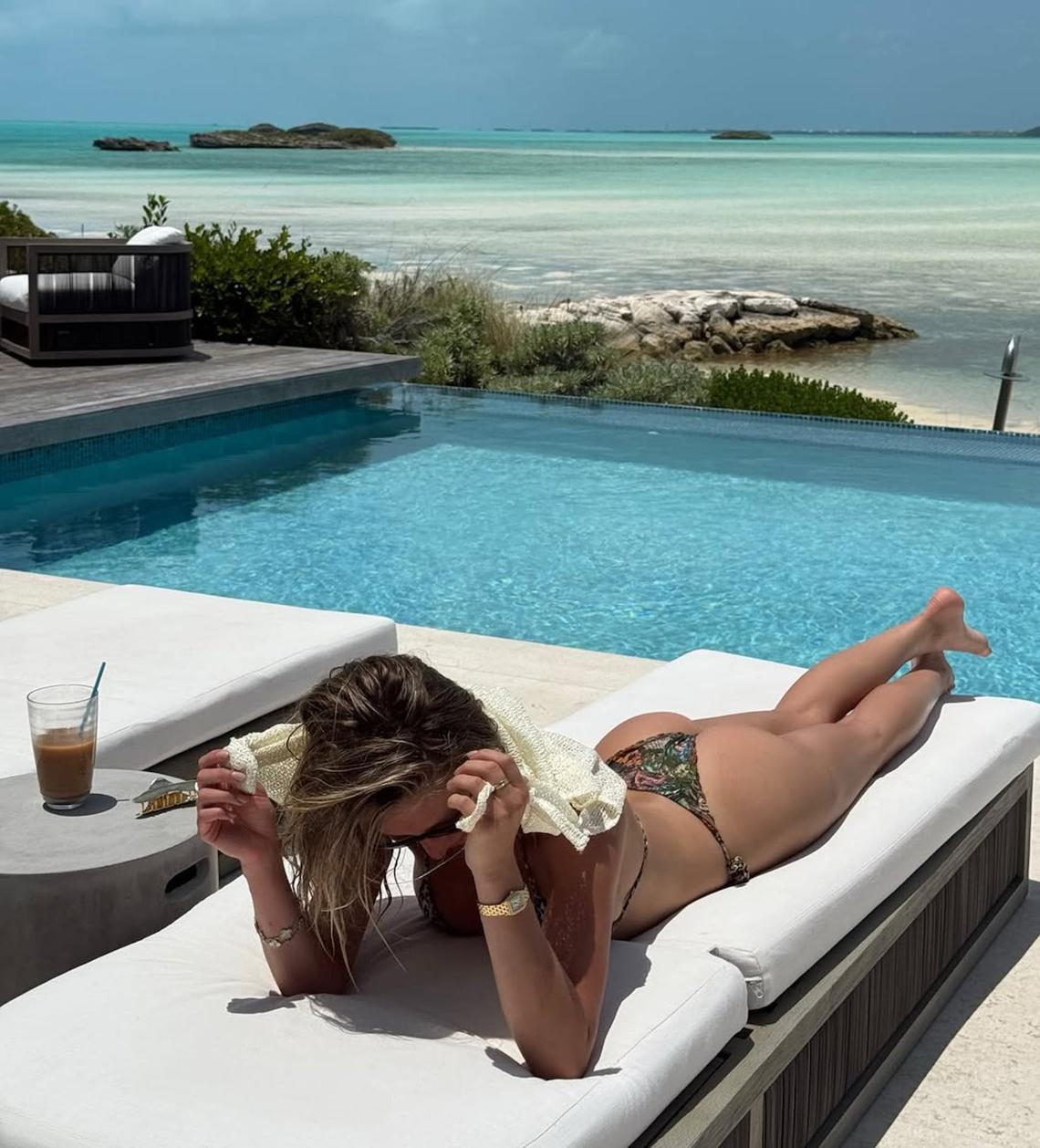 Girl's Trip Files Alix sat poolside, while also beachside, during an April 2025 trip to Turks and Caicos with the girls. The influencer wore a printed ruffled bikini while she sipped on an iced coffee in paradise. Alix Earle/ Instagram