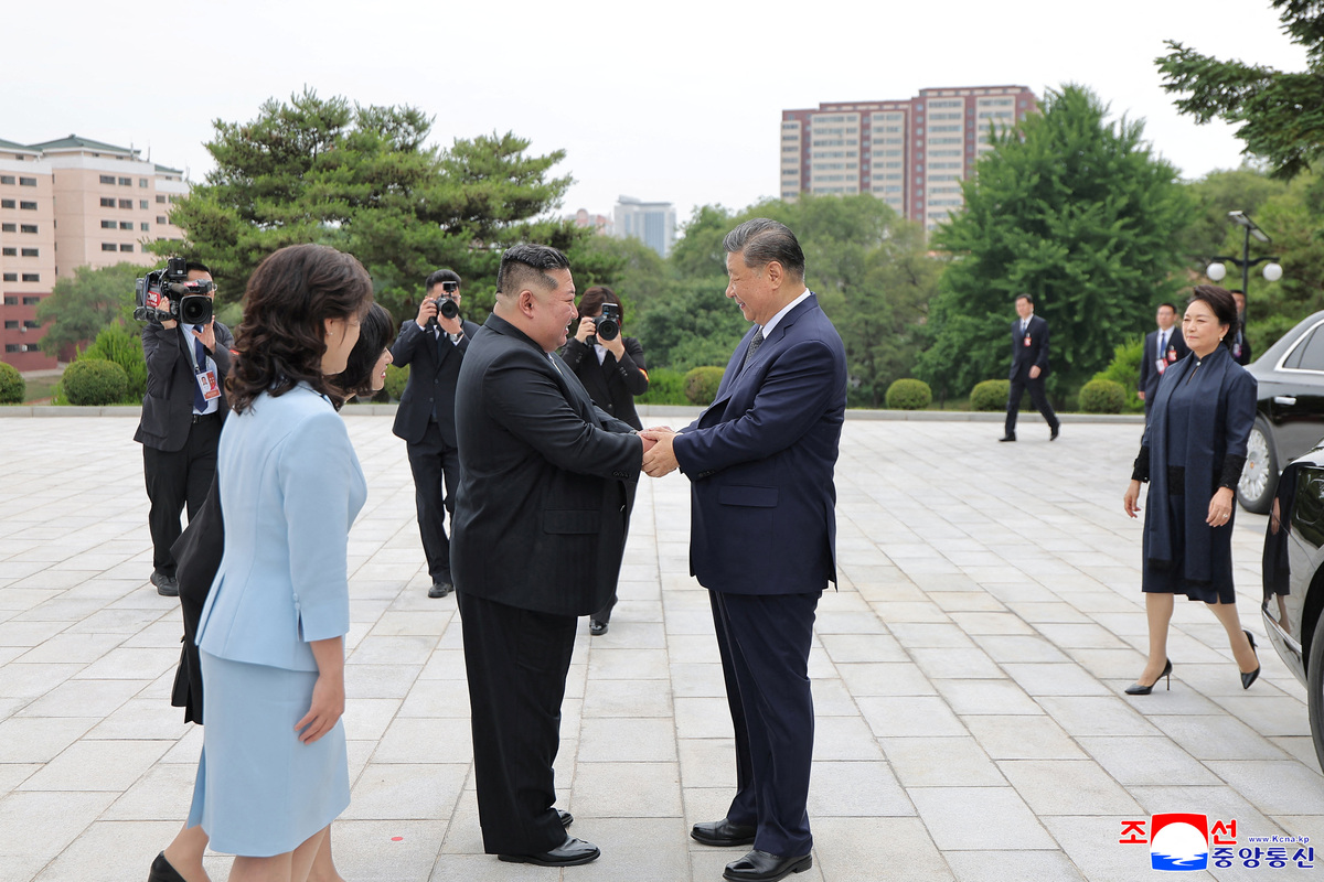 Chinese President Xi Jinping and North Korean leader Kim Jong Un greet as they visit the Tower of Friendship in Pyongyang, North Korea, June 9, 2026, in this picture released June 10, 2026. KCNA via REUTERS