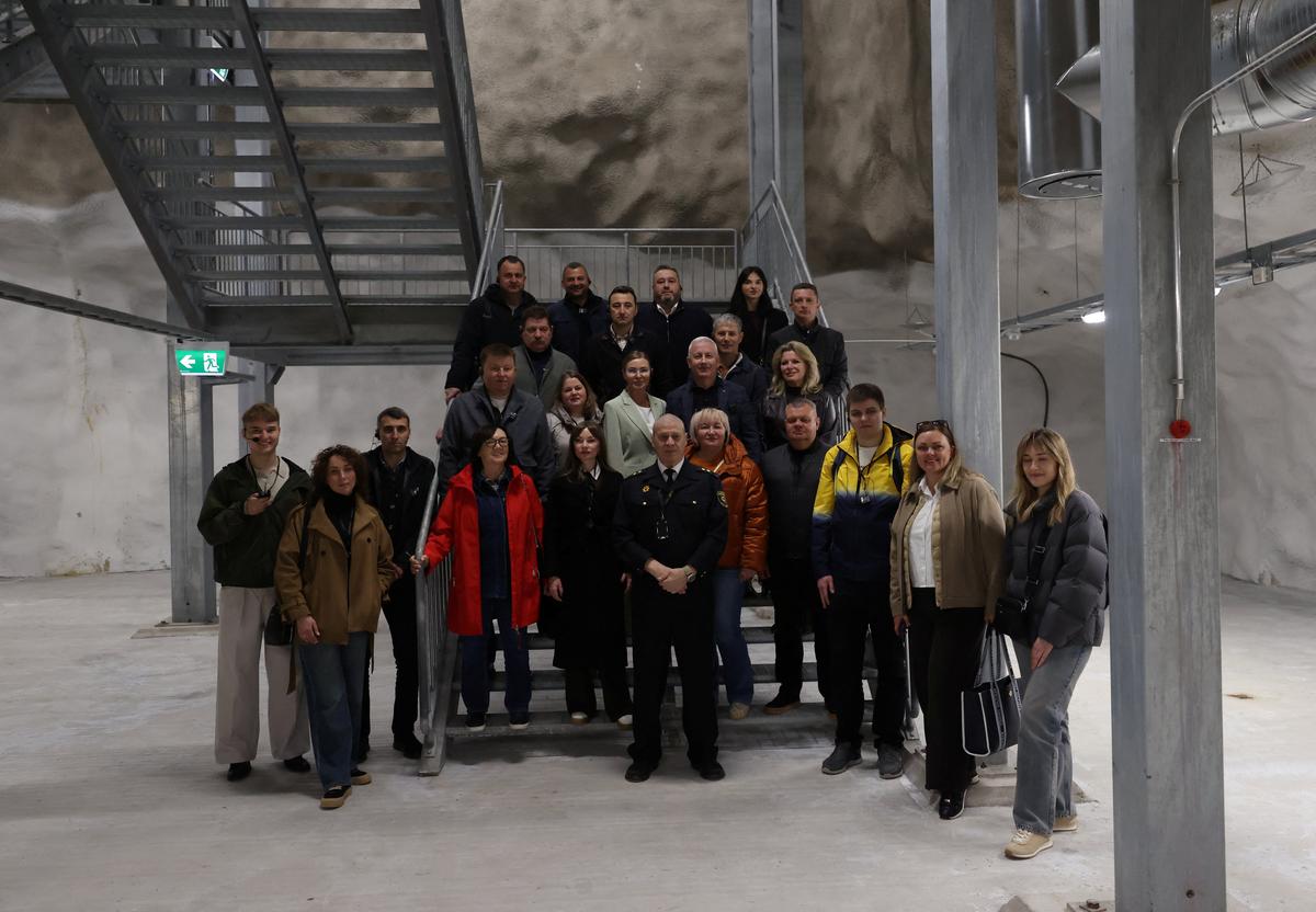Jukka-Pekka Schroderus from the City of Helsinki rescue department and members of the Ukrainian Mayors' Club pose for a picture during a visit to Merihaka civil shelter in Helsinki, Finland, May 6, 2026. REUTERS/Leonhard Foeger