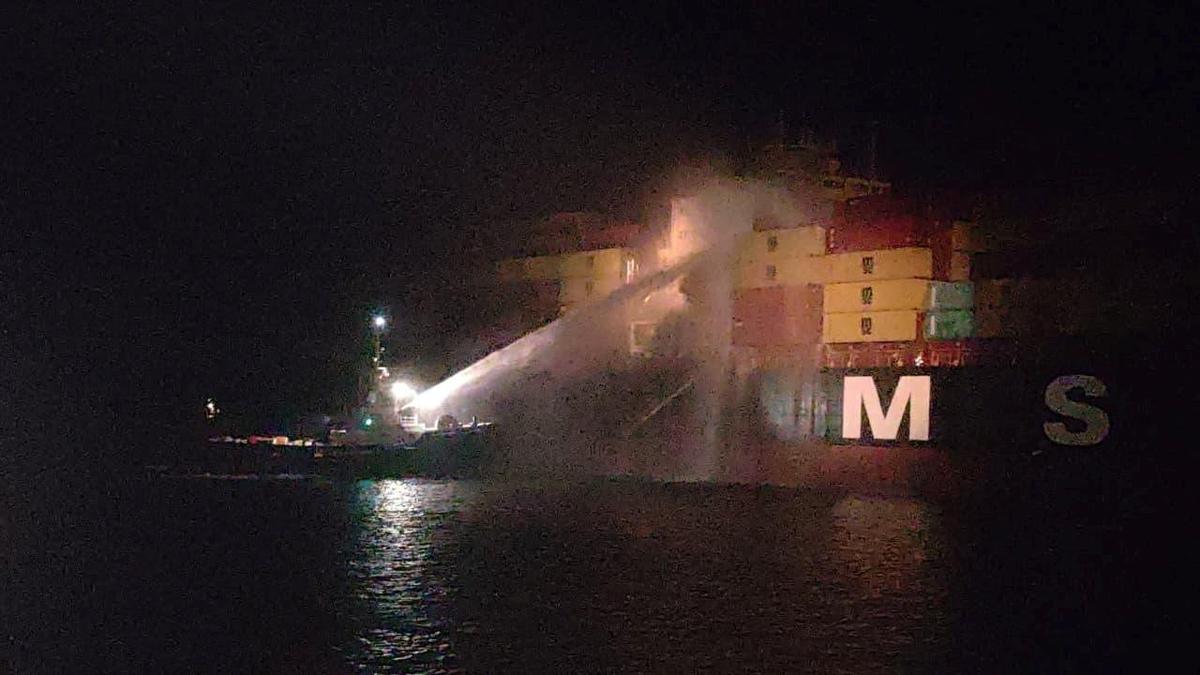 Personnel on a boat work to extinguish a fire on the Sariska V vessel in the Persian Gulf after MSC, the world's largest shipping group, said the vessel was struck by two projectiles in Iraq's Umm Qasr port, in this handout image released June 2, 2026. IRAQI PORTS COMPANY MEDIA/Handout via REUTERS.