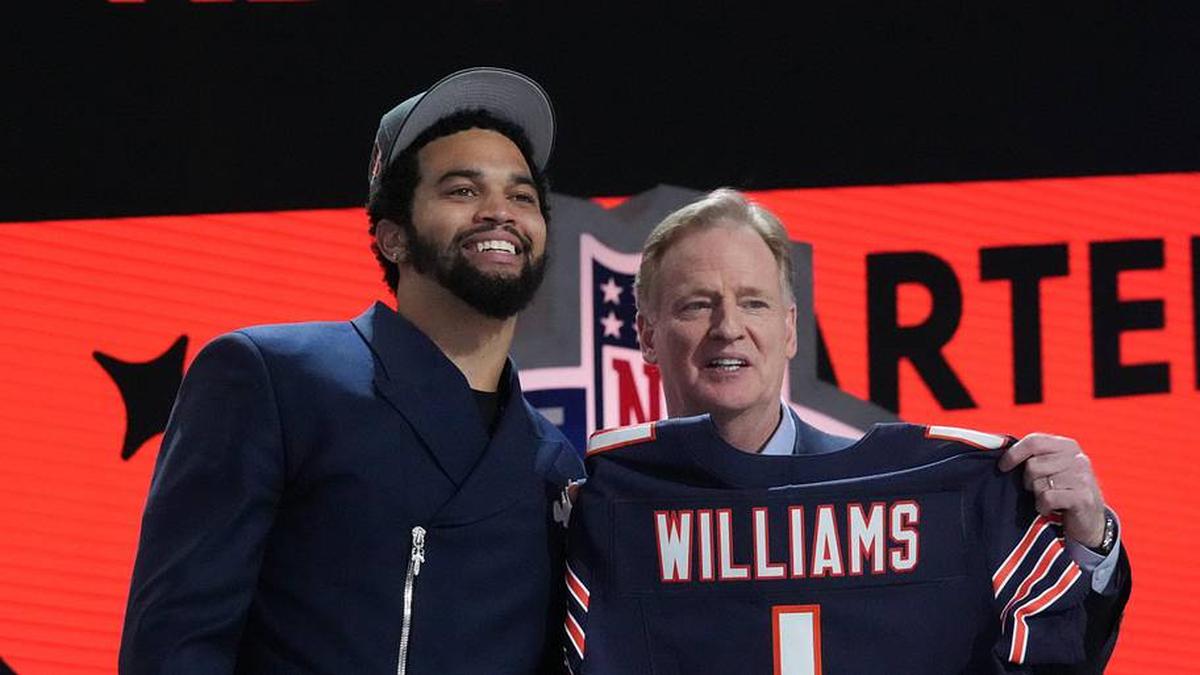  Apr 25, 2024; Detroit, MI, USA; Southern California Trojans quarterback Caleb Williams poses with NFL commissioner Roger Goodell after being selected by the Chicago Bears as the No. 1 pick in the first round of the 2024 NFL Draft at Campus Martius Park and Hart Plaza. Mandatory Credit: Kirby Lee-Imagn Images | Kirby Lee-Imagn Images 
