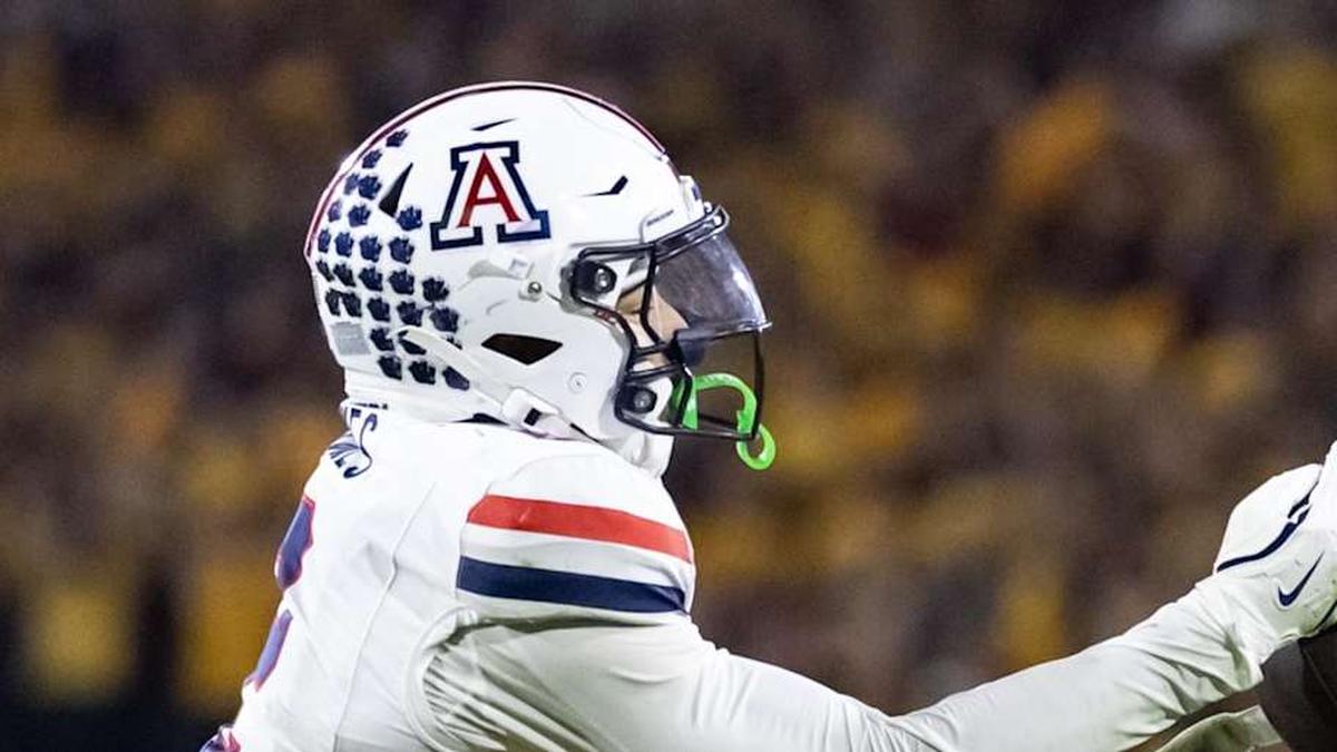  Nov 28, 2025; Tempe, Arizona, USA; Arizona Wildcats defensive back Treydan Stukes (2) intercepts the ball against Arizona State Sun Devils wide receiver Jaren Hamilton (16) in the second half during the 99th Territorial Cup at Mountain America Stadium. Mandatory Credit: Mark J. Rebilas-Imagn Images | Mark J. Rebilas-Imagn Images 