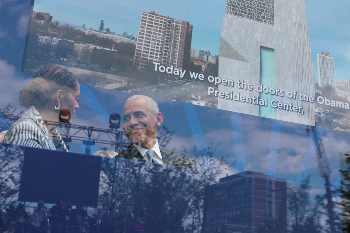 Former U.S. President Barack Obama and his wife, former first lady Michelle Obama attend the dedication ceremony for the opening of the Obama Presidential Centre in Chicago, Illinois, U.S., June 18, 2026. Picture taken through the bulletproof glass. REUTERS/Jonathan Ernst