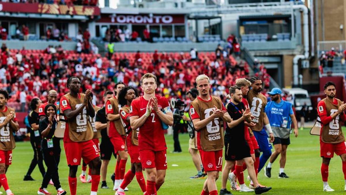  Canadian players saluted the fans after securing the country's first point at a men's World Cup. | Mathew Tsang/Icon Sportswire/Getty Images 