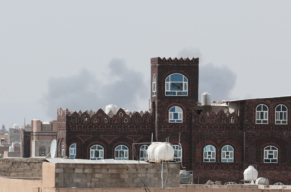 Smoke rises after an airstrike hit the Sanaa International Airport, as seen from Sanaa, Yemen, July 13, 2026. REUTERS/Khaled Abdullah