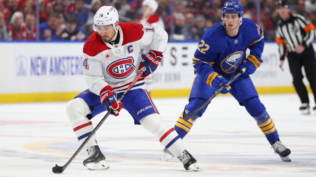 
                 Jan 31, 2026; Buffalo, New York, USA;  Buffalo Sabres right wing Jack Quinn (22) watches as Montréal Canadiens center Nick Suzuki (14) skates with the puck during the first period at KeyBank Center. Mandatory Credit: Timothy T. Ludwig-Imagn Images 
              