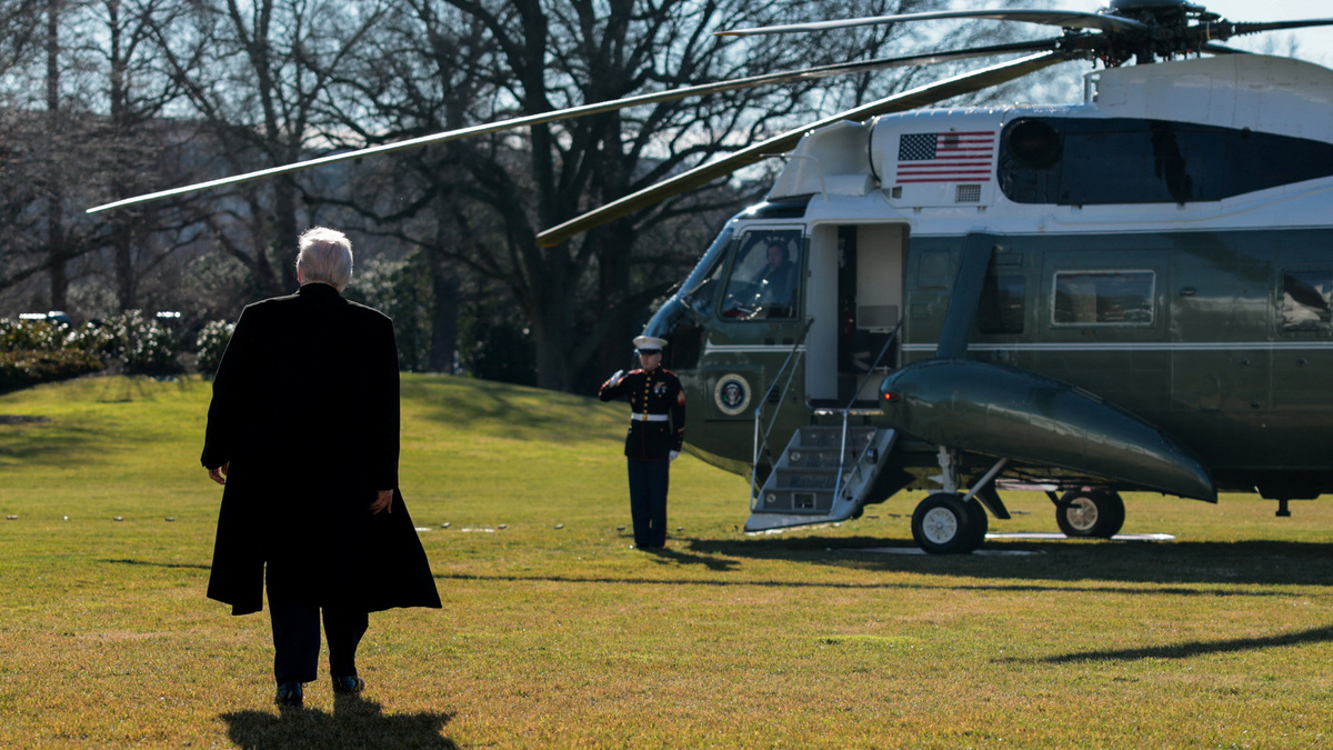 U.S. President Donald Trump walks towards the Marine One helicopter to depart the White House for travel to Detroit, Michigan, in Washington, D.C. U.S. January 13, 2026. REUTERS/Jonathan Ernst