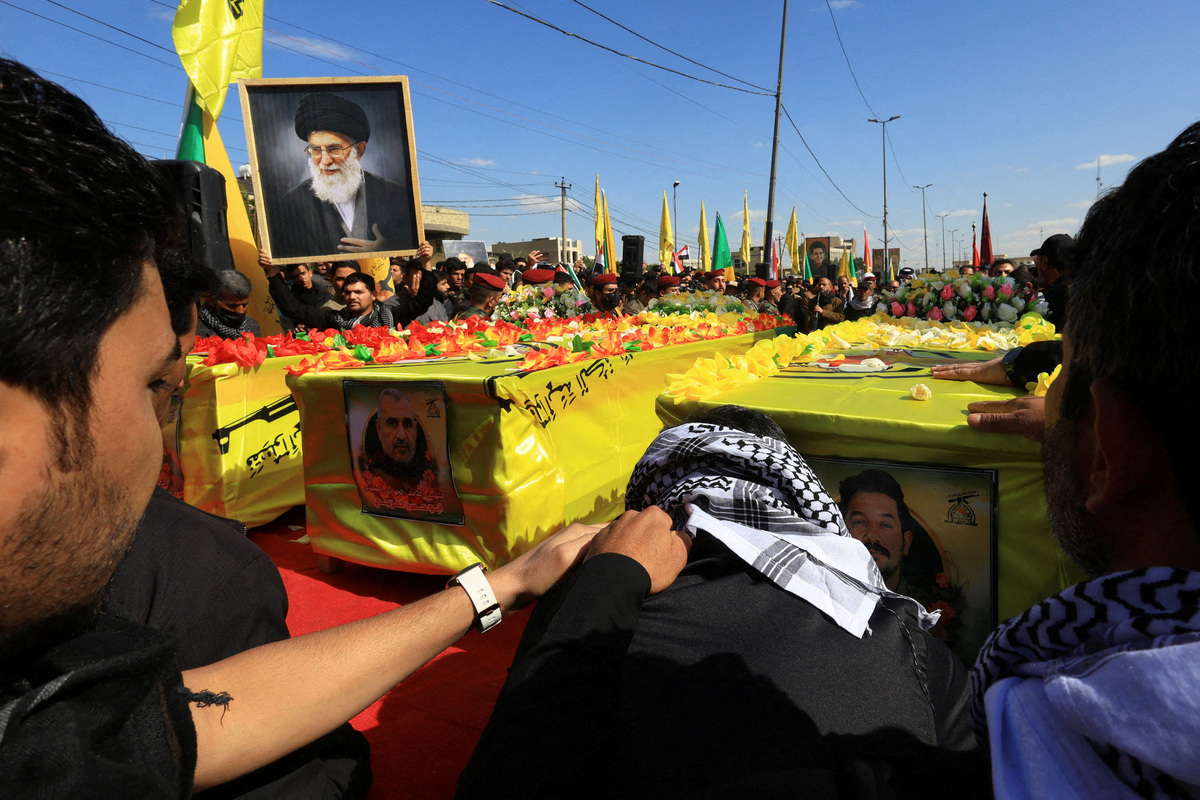 FILE PHOTO: Mourners attend the funeral procession of Ali Hassan Abdullah, a commander from Islamic Resistance in Iraq, and people who were accompanying him and were killed in an airstrike that targeted their vehicle south of Baghdad, according to police sources, in Baghdad, Iraq, March 5, 2026. REUTERS/Thaier Al-Sudani/File Photo
