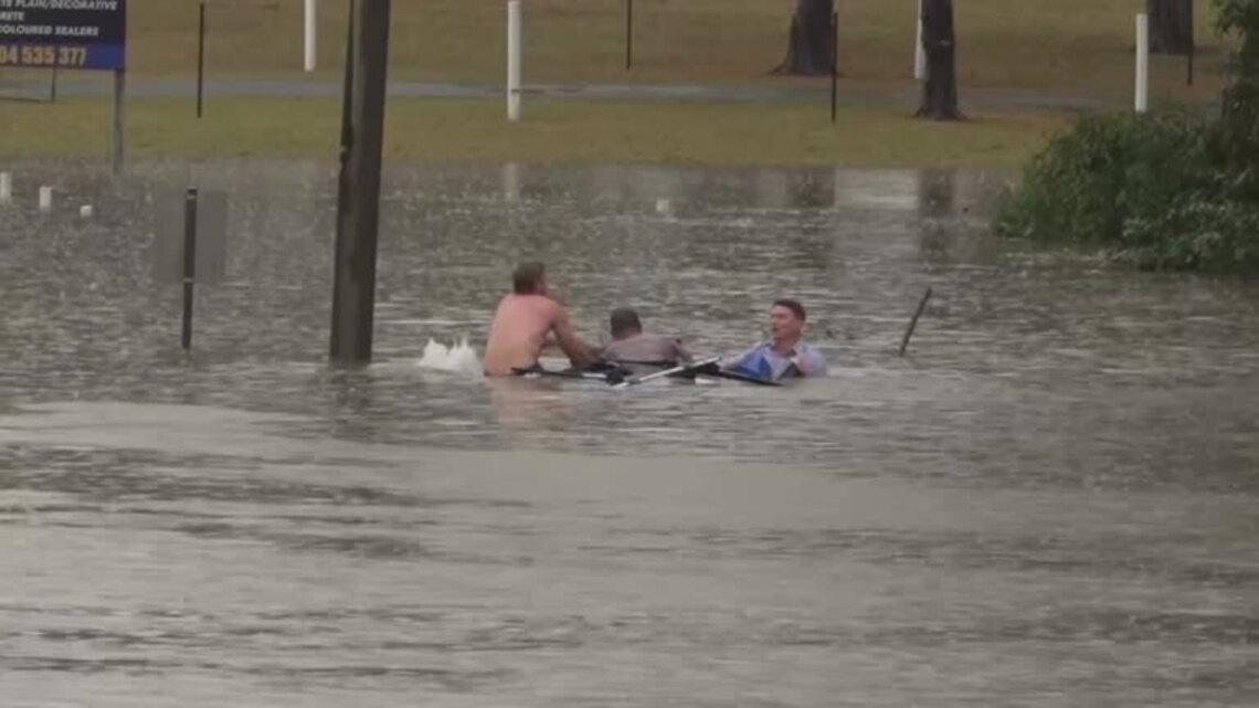 Australian TV reporter rescues man from sinking car during floods
