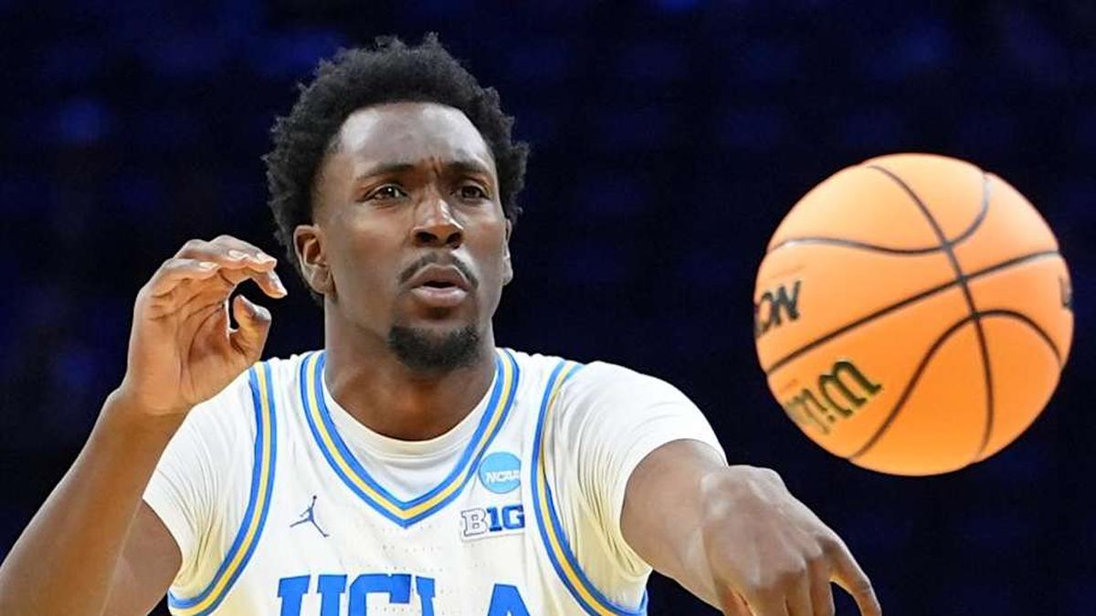  Mar 20, 2026; Philadelphia, PA, USA; UCLA Bruins center Xavier Booker (1) makes a pass against the UCF Knights in the first half during a first round game of the men's 2026 NCAA Tournament at Xfinity Mobile Arena. Mandatory Credit: Kyle Ross-Imagn Images | Kyle Ross-Imagn Images 