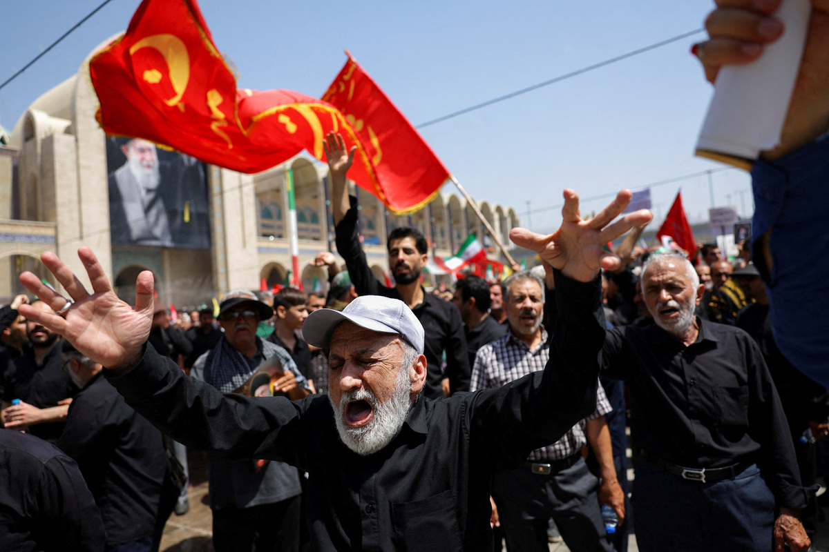 People attend a public farewell ceremony to pay their respects to late Supreme Leader Ayatollah Ali Khamenei, who was killed on February 28 in Israeli and U.S. airstrikes, at the Imam Khomeini Grand Mosalla, in Tehran, Iran July 4, 2026.  REUTERS/Murad Sezer  Foreign media in Iran operate under guidelines set by the Ministry of Culture and Islamic Guidance, which regulates press activity and permissions