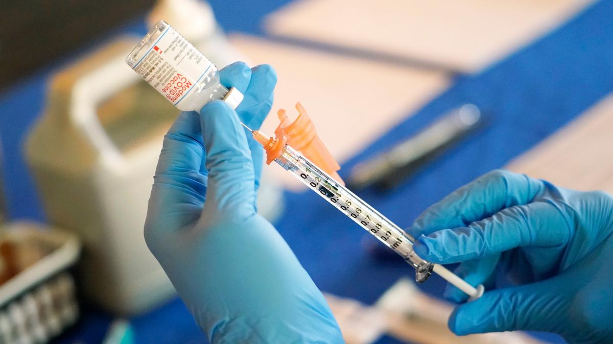 File photo of a nurse preparing a syringe.
