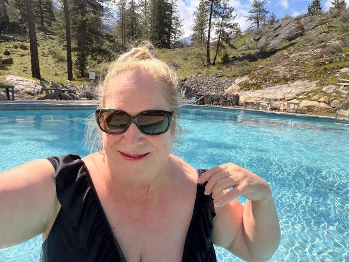  The author relaxing at this gorgeous pool she had all to herself. Look at that view! Photo credit: Marguerite "Peggy" Cleveland 