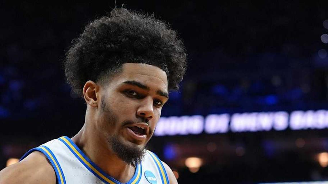  Mar 20, 2026; Philadelphia, PA, USA; UCF Knights forward Jamichael Stillwell (4) grabs a rebound against UCLA Bruins guard Eric Freeny (8) in the second half during a first round game of the men's 2026 NCAA Tournament at Xfinity Mobile Arena. Mandatory Credit: Kyle Ross-Imagn Images | Kyle Ross-Imagn Images 