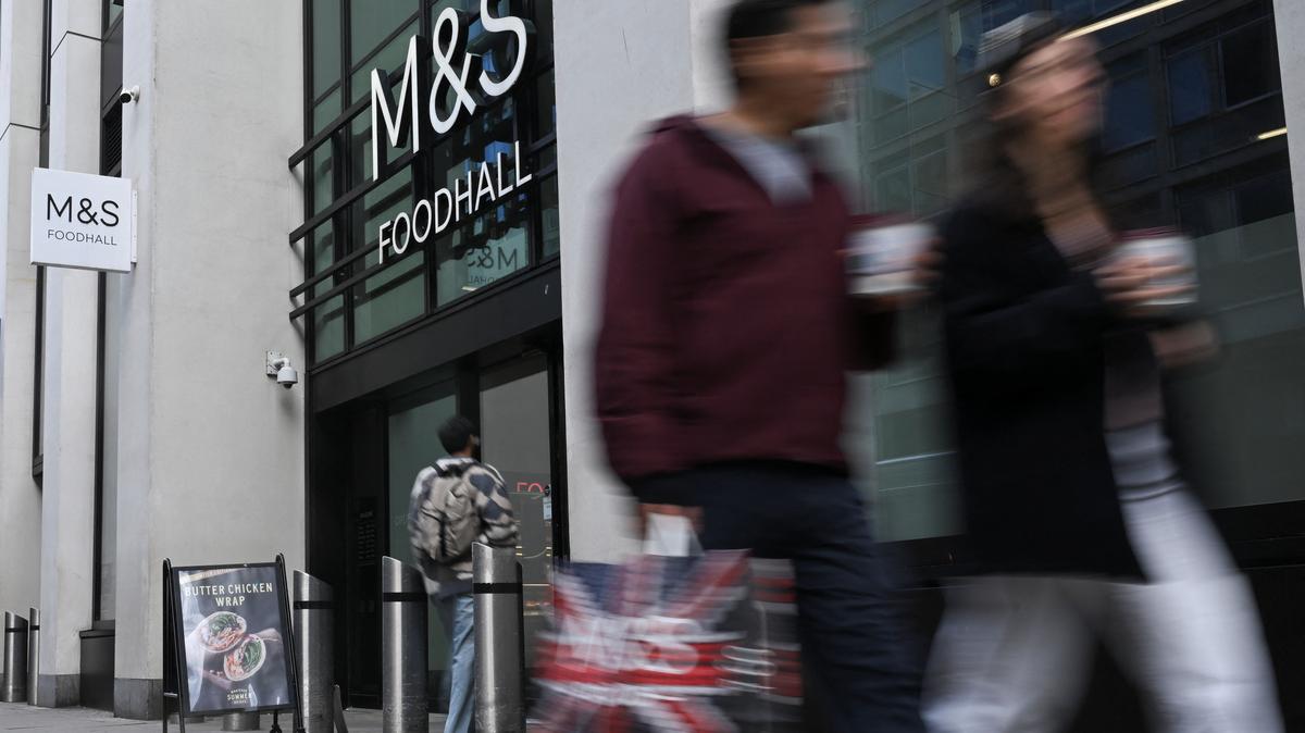 People walk past M&S Foodhall in Waterloo in London, Britain, May 20, 2026. REUTERS/Jaimi Joy