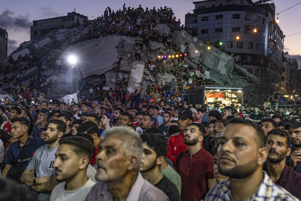NYTSELECTS - People gather to watch the World Cup round of 16 soccer match between Egypt and Argentina in Gaza City, July 7, 2026. After watching Egypt lead for almost the entire match, a last-minute victory by Argentina has driven fans to tears and conspiracy theories. (Saher Alghorra/The New York Times)