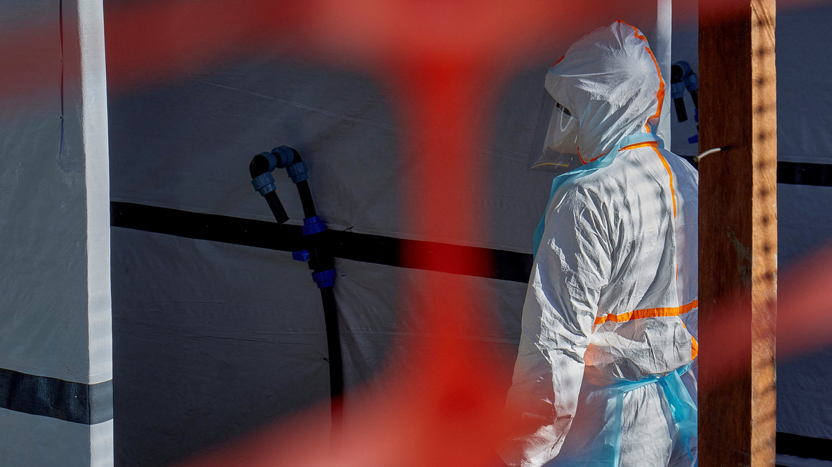 A health worker is dressed up in personal protective equipment (PPE) at the Evangelical Medical Center, one of the facilities at the forefront of the response to the Ebola outbreak, as agencies intensify efforts to contain a new Ebola outbreak caused by the Bundibugyo virus strain, in Bunia, Ituri province, Democratic Republic of Congo, May 31, 2026. REUTERS/Gradel Muyisa Mumbere