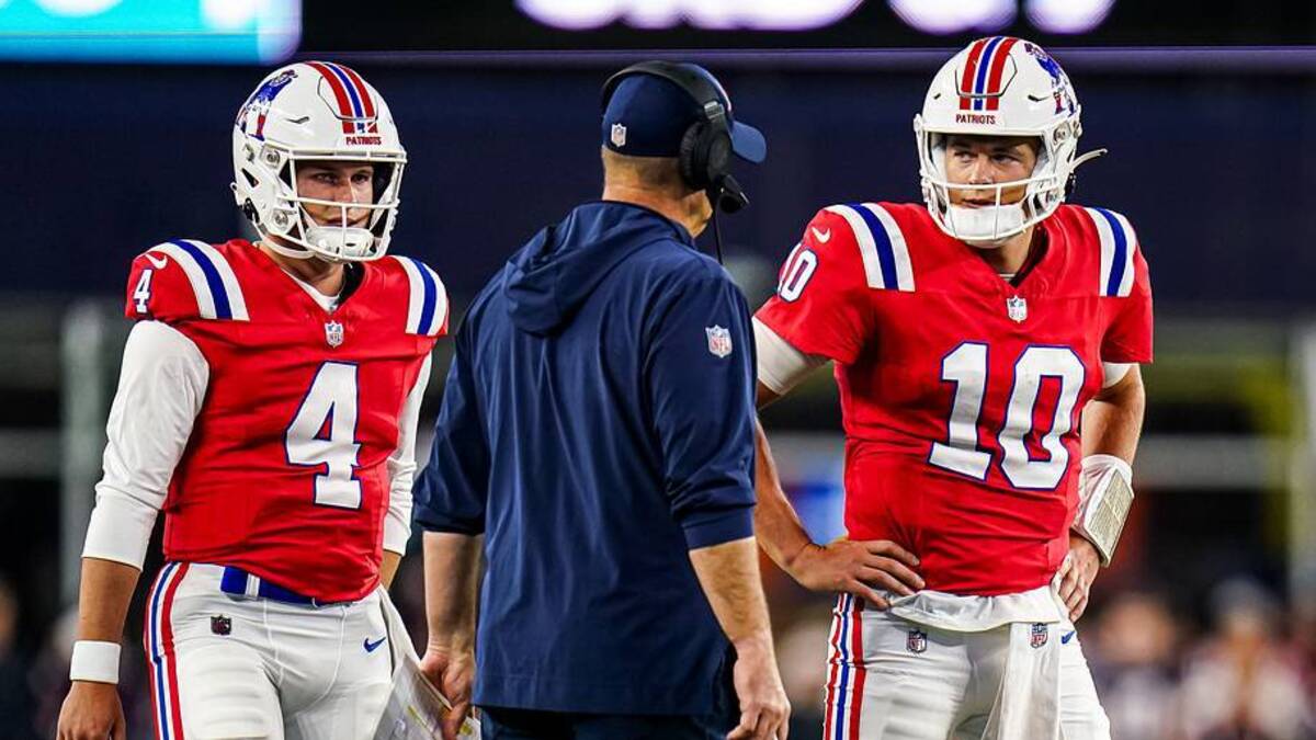  Sep 17, 2023; Foxborough, Massachusetts, USA; New England Patriots quarterback Mac Jones (10) and quarterback Bailey Zappe (4) talk with offensive coordinator/quarterbacks coach Bill O'Brien in the second quarter at Gillette Stadium. Mandatory Credit: David Butler II-USA TODAY Sports | USA TODAY Sports via Reuters Connect 