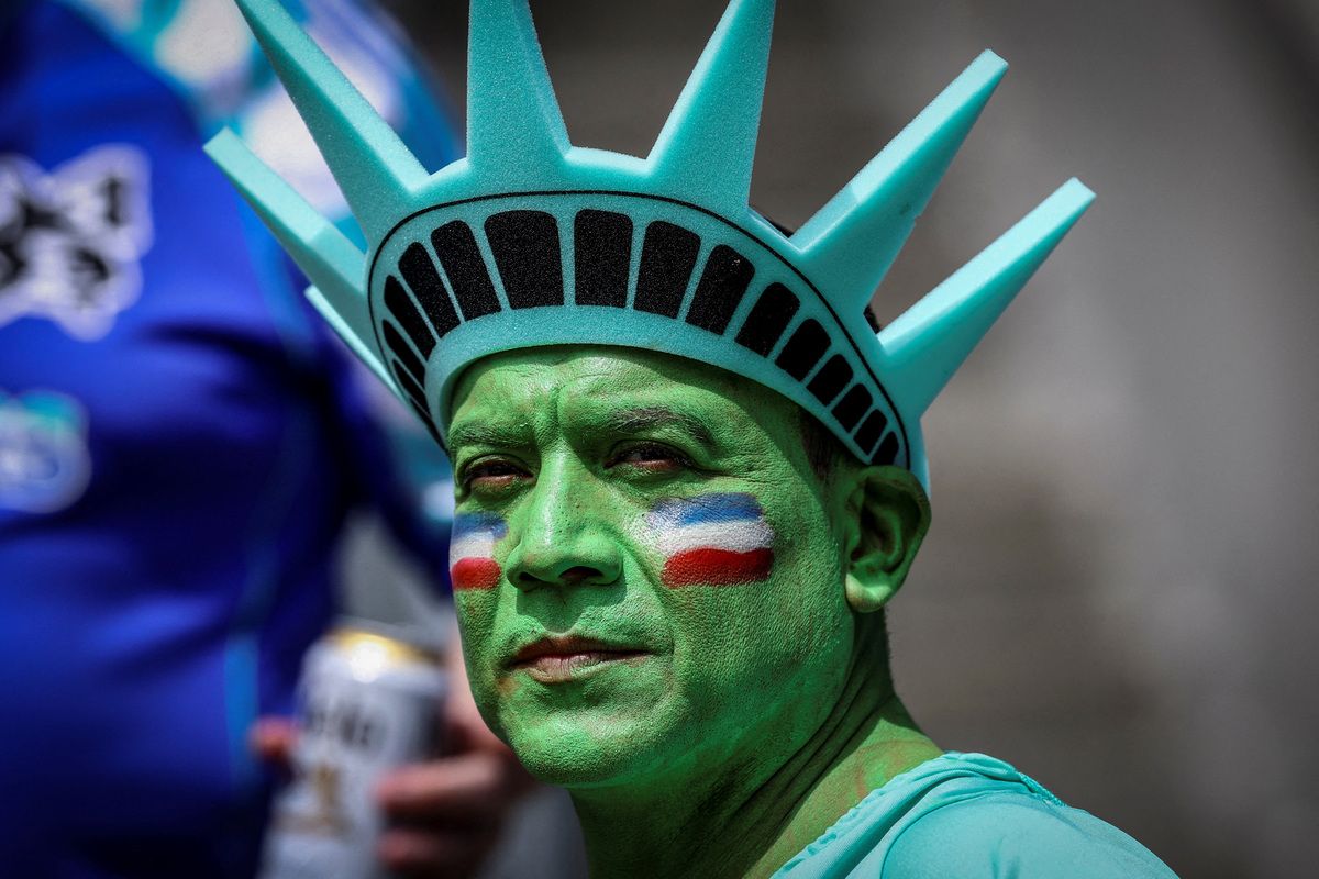 Soccer Football - FIFA World Cup 2026 - Group D - United States v Australia - Seattle Stadium, Seattle, Washington, U.S. - June 19, 2026 A United States fan dressed as the Statue of Liberty inside the stadium before the match REUTERS/Albert Gea
