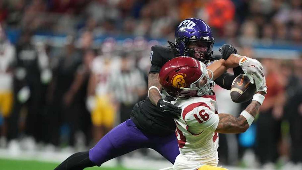  Dec 30, 2025; San Antonio, TX, USA; Southern California Trojans wide receiver Tanook Hines (16) catches the ball against TCU Horned Frogs cornerback Vernon Glover (26) in the second half during the Alamo Bowl at Alamodome. Mandatory Credit: Kirby Lee-Imagn Images | Kirby Lee-Imagn Images 