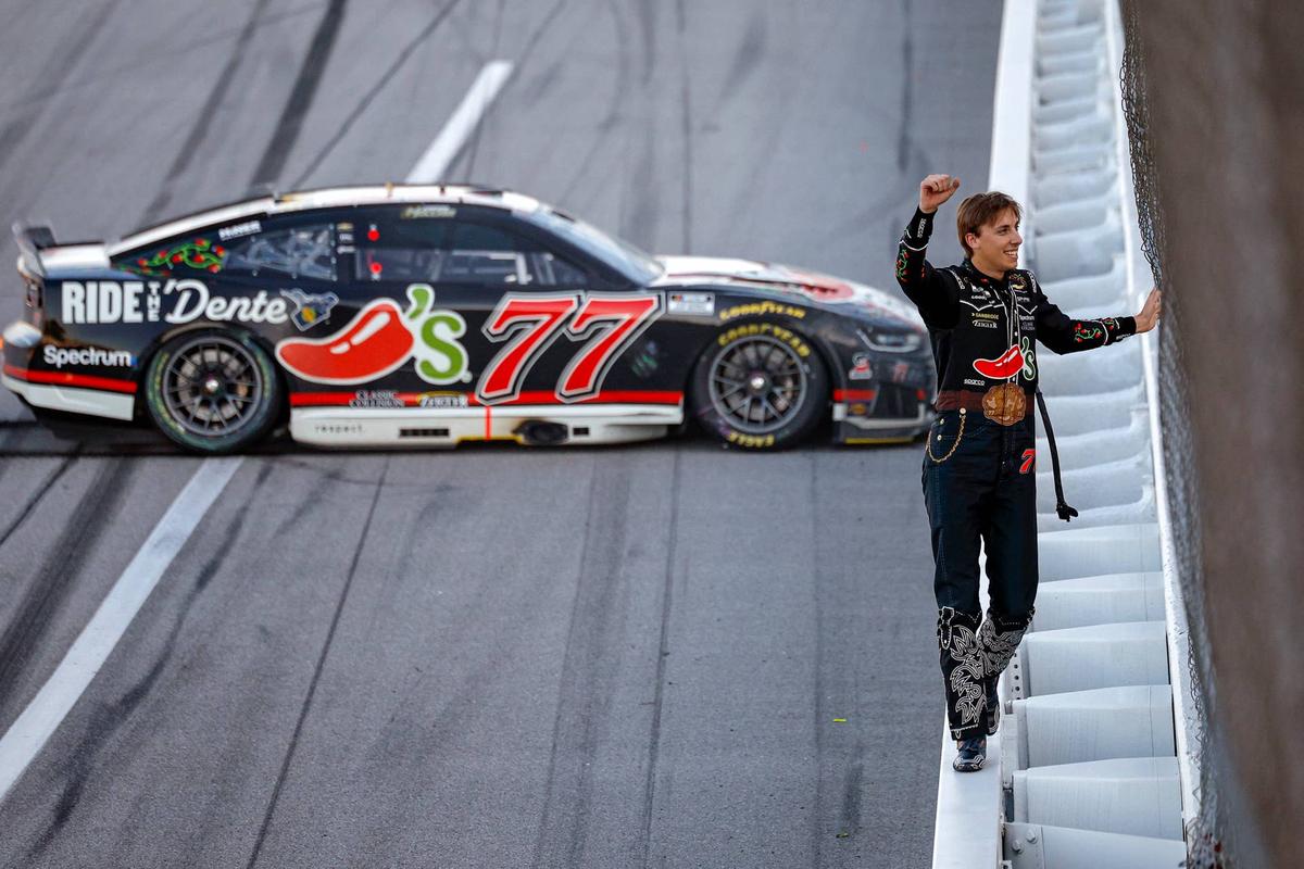  Carson Hocevar celebrates and soaks in the roar of the fans at Talladega. (Photo by Sean Gardner/Getty Images)