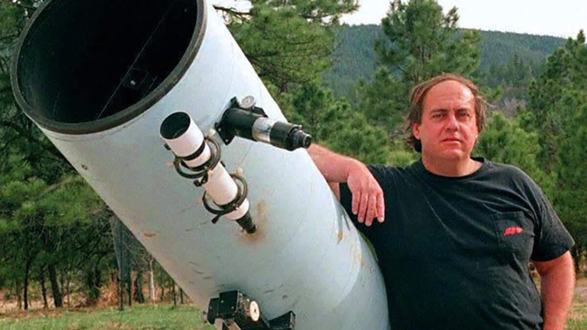 Astronomer Alan Hale, 39, poses next to the telescope that he used to discover the Hale-Bopp comet on April 3, 1997. Hale, who wheeled a telescope out of his New Mexico garage on July 23, 1995, and spotted a fuzzy object in the constellation Sagittarius, discovering what may be the most-viewed comet in human history -- known as Hale-Bopp, after Hale and Thomas Bopp, another sky watcher who saw it the same night -- died on June 6. He was 68.