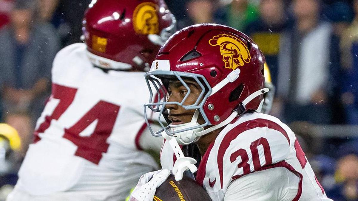  Oct 18, 2025; South Bend, Indiana, USA; Southern California Trojans running back King Miller (30) runs the ball against the Notre Dame Fighting Irish during the first half at Notre Dame Stadium. Mandatory Credit: Michael Caterina-Imagn Images | Michael Caterina-Imagn Images 