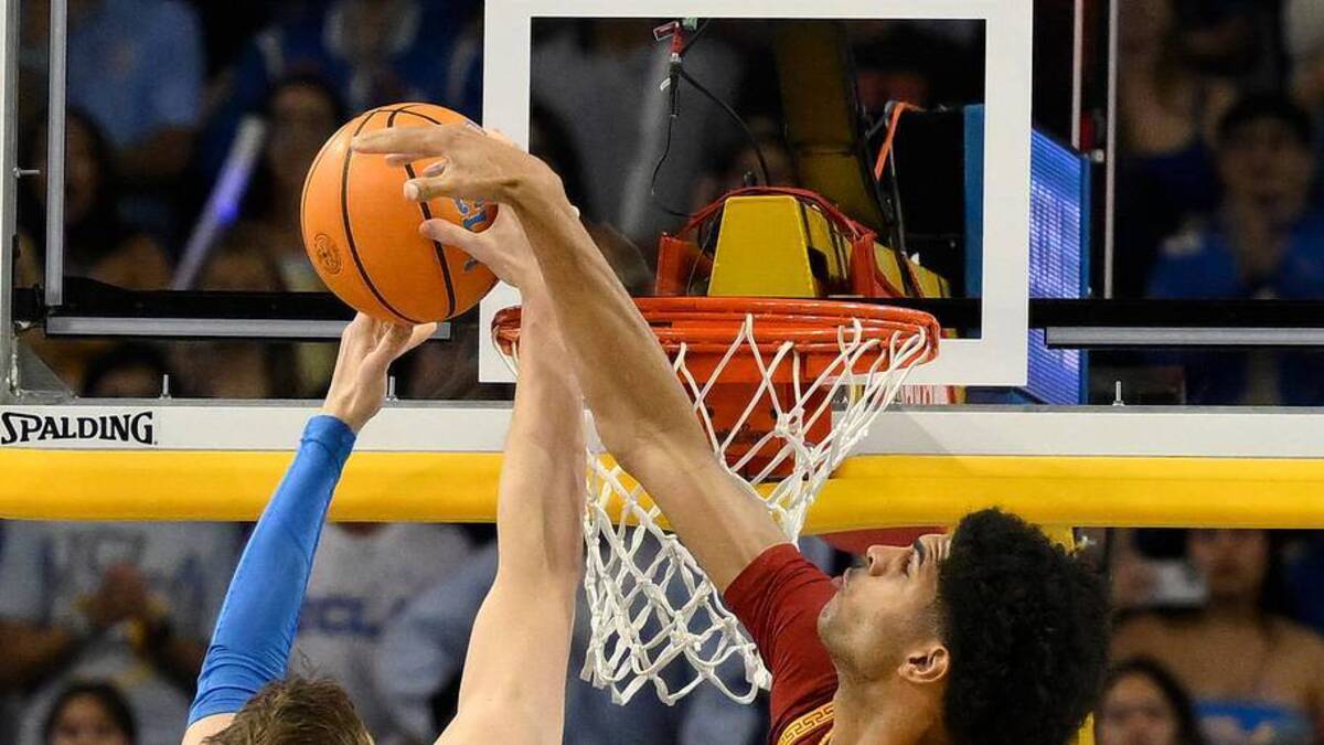  Feb 24, 2026; Los Angeles, California, USA; Southern California Trojans forward Jacob Cofie (6) blocks a shot by UCLA Bruins forward Tyler Bilodeau (34) during the first half at Pauley Pavilion presented by Wescom Financial. Mandatory Credit: Robert Hanashiro-Imagn Images | Robert Hanashiro-Imagn Images 