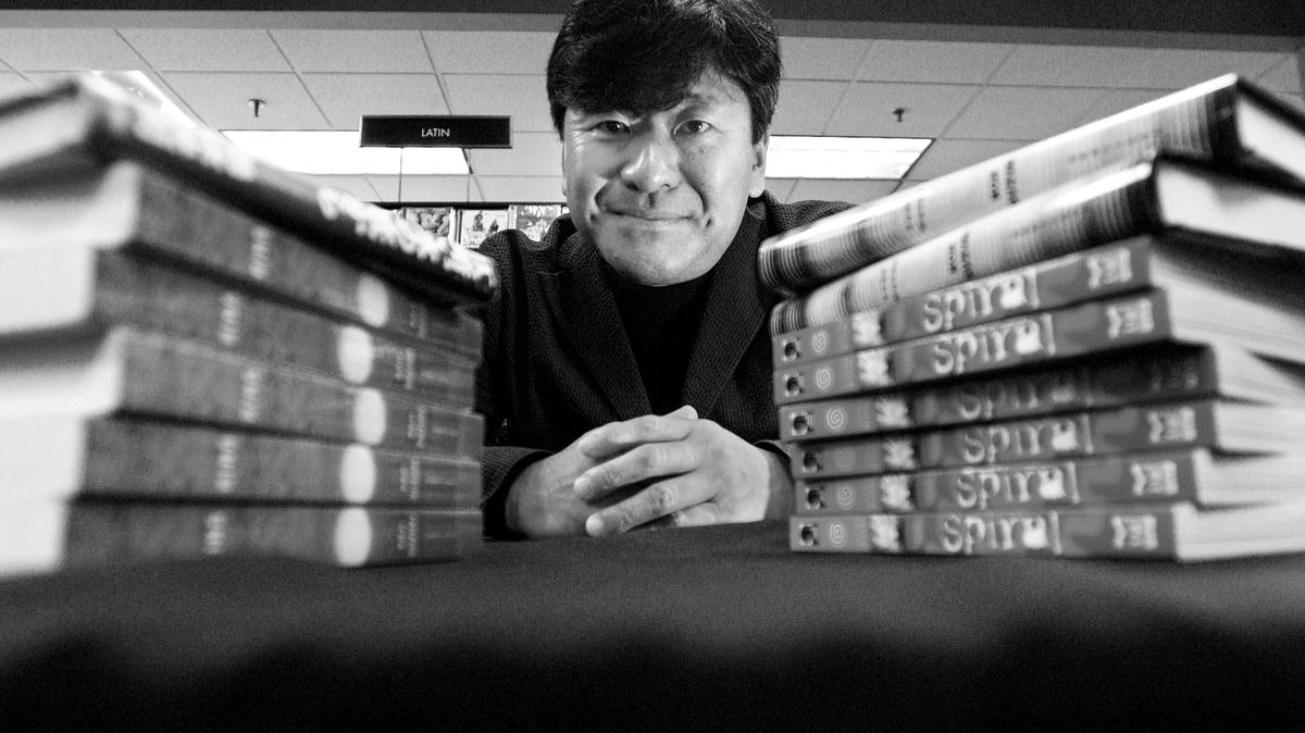 Author Koji Suzuki, seen in 2004, was a novelist and short-story writer whose best-selling "Ring" series helped create a genre known as J-horror that relied more on psychological suspense than on gore, spawning a multimedia franchise that included a 2002 blockbuster Hollywood movie.
