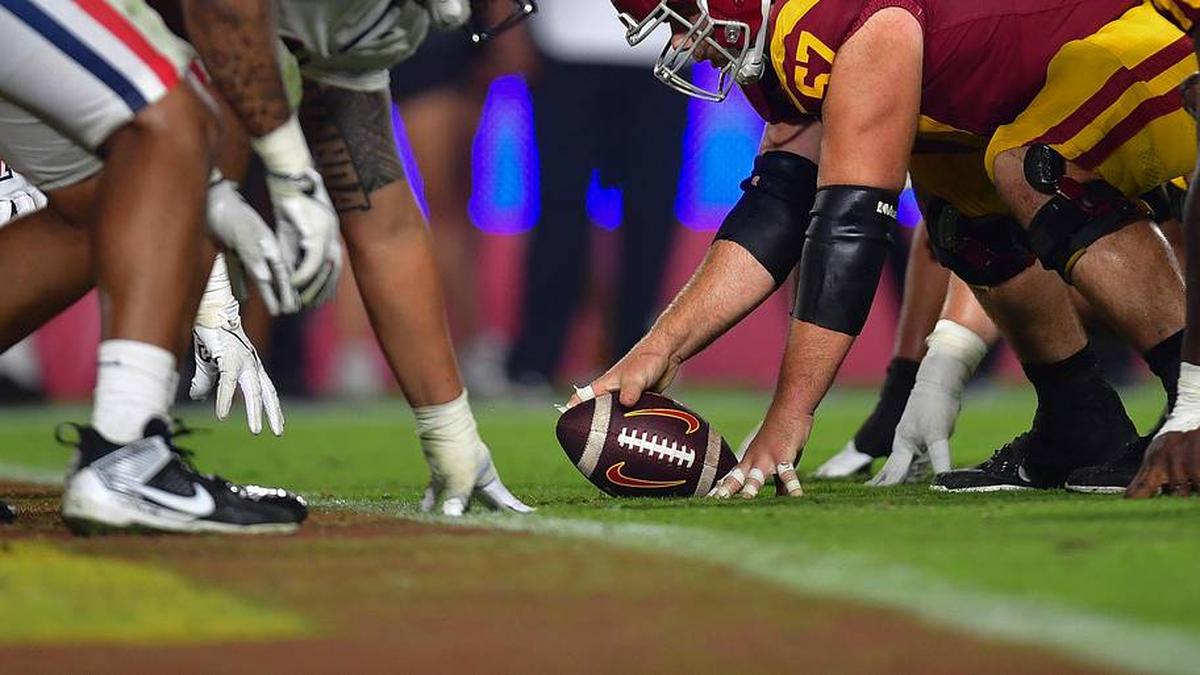  Oct 7, 2023; Los Angeles, California, USA; Southern California Trojans offensive lineman Justin Dedich (57) lines up against the Arizona Wildcats defense during the second half at Los Angeles Memorial Coliseum. Mandatory Credit: Gary A. Vasquez-Imagn Images | Gary A. Vasquez-Imagn Images 