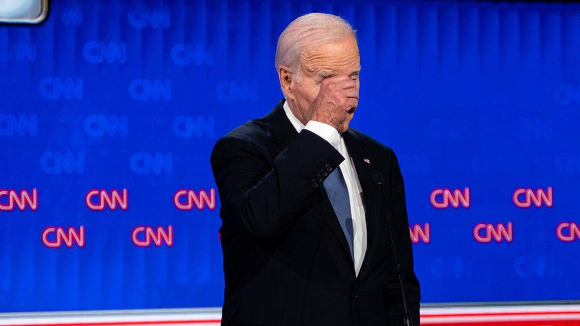 President Joe Biden rubs his face while on stage during the presidential debate with former President Donald Trump in Atlanta on Thursday, June 27, 2024.