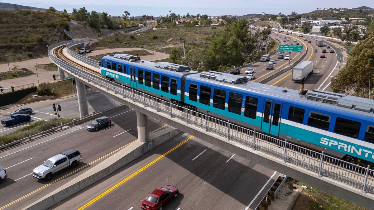 A North County Transit District Sprinter train passes over Highway 78 on one of the systems two bridges over the freeway that were built to accomodate the train station at California State University San Marcos thats to the south of the tracks that were there for freight trains prior to the Sprinter system. (Charlie Neuman / For The San Diego Union-Tribune)