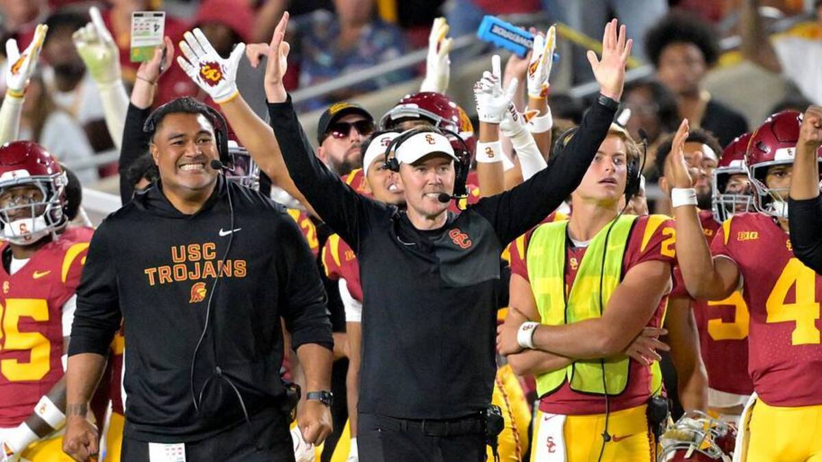  Oct 11, 2025; Los Angeles, California, USA; USC Trojans head coach Lincoln Riley (wearing white visor) celebrates along with defensive end coach Shaun Nua after kicker Ryon Sayeri (48) hit a 54-yard field goal in the second half against the Michigan Wolverines at United Airlines Field at the Los Angeles Memorial Coliseum. Mandatory Credit: Jayne Kamin-Oncea-Imagn Images | Jayne Kamin-Oncea-Imagn Images 