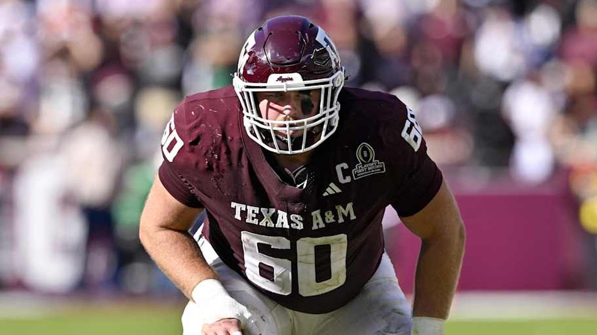  Dec 20, 2025; College Station, TX, USA; Texas A&M Aggies offensive lineman Trey Zuhn III (60) lines up during the game between the Aggies and the Hurricanes at Kyle Field. Mandatory Credit: Jerome Miron-Imagn Images | Jerome Miron-Imagn Images 