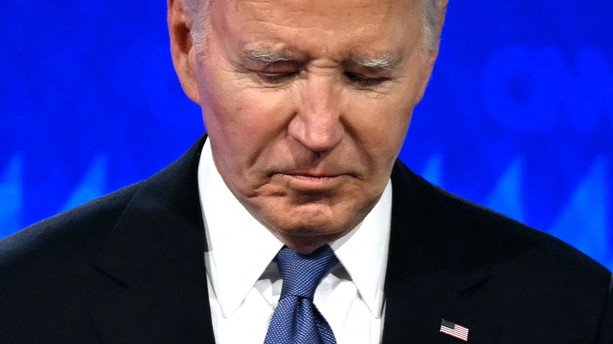 President Joe Biden looks down as he participates in a presidential debate with former President and Republican presidential candidate Donald Trump at CNN’s studios in Atlanta, on June 27, 2024.
