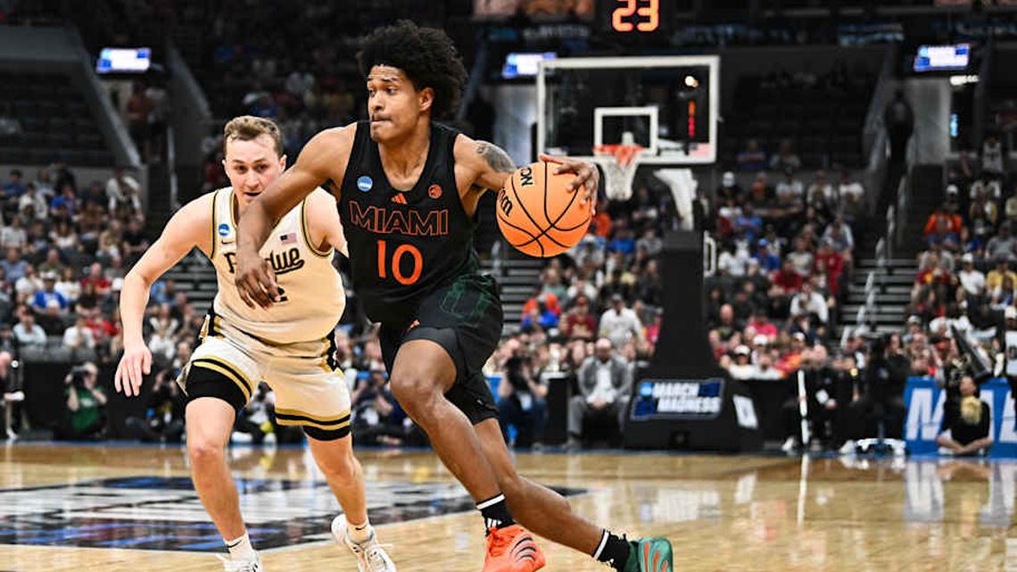  Mar 22, 2026; St. Louis, MO, USA; Miami Hurricanes guard Tru Washington (10) drives to the basket as Purdue Boilermakers guard Fletcher Loyer (2) defends during the second half during a second round game of the men's 2026 NCAA Tournament at Enterprise Center. Mandatory Credit: Jeff Le-Imagn Images | Jeff Le-Imagn Images 