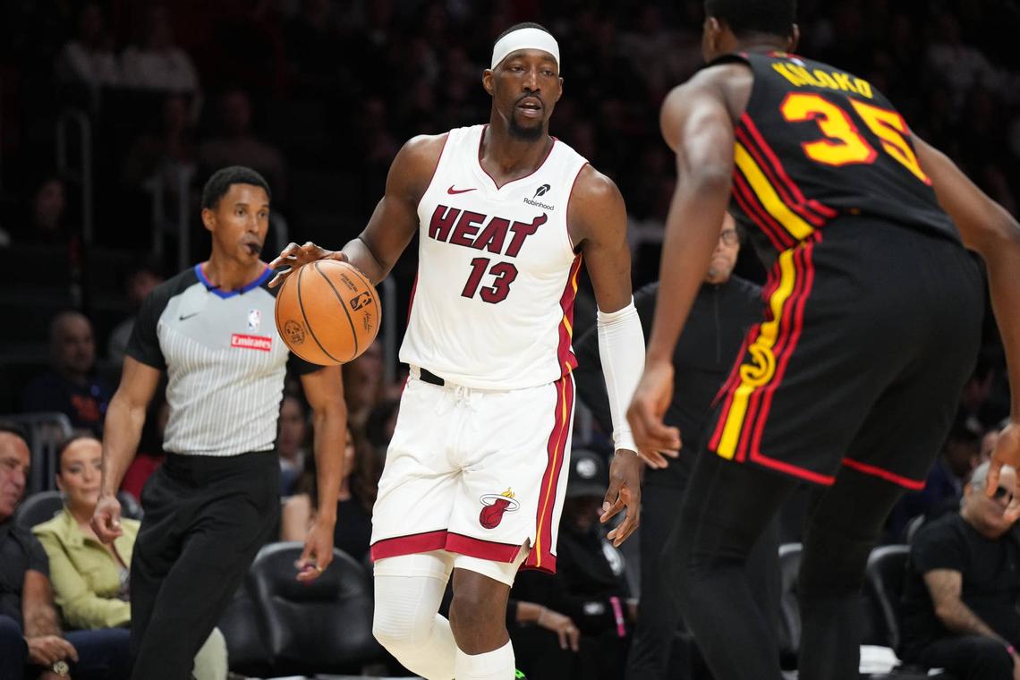  Miami heat forward Bam Adebayo (13) dribbles against Atlanta Hawks center Christian Koloko (35). 