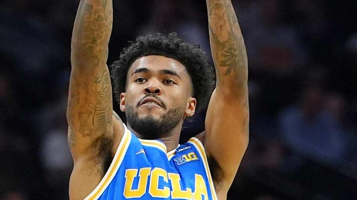  Mar 22, 2026; Philadelphia, PA, USA; UCLA Bruins guard Donovan Dent (2) shoots the ball against the UConn Huskies in the first half during a second round game of the men's 2026 NCAA Tournament at Xfinity Mobile Arena. Mandatory Credit: Kyle Ross-Imagn Images | Kyle Ross-Imagn Images 