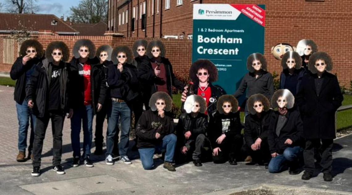  The group visiting where York City's former ground used to me. (Martin Brunnschweiler via SWNS) 