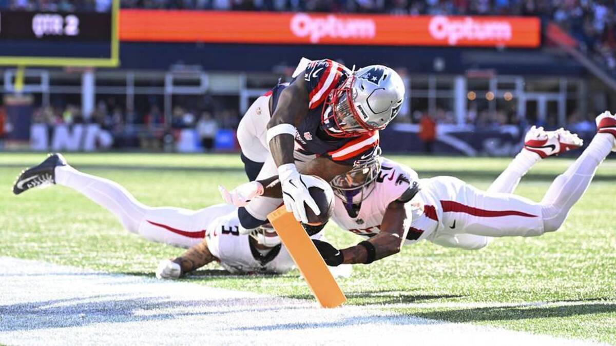  Nov 2, 2025; Foxborough, Massachusetts, USA; New England Patriots wide receiver Stefon Diggs (8) runs for a touchdown against Atlanta Falcons safety Jessie Bates III (3) and cornerback Mike Hughes (21) during the first half at Gillette Stadium. Mandatory Credit: Eric Canha-Imagn Images | Eric Canha-Imagn Images 