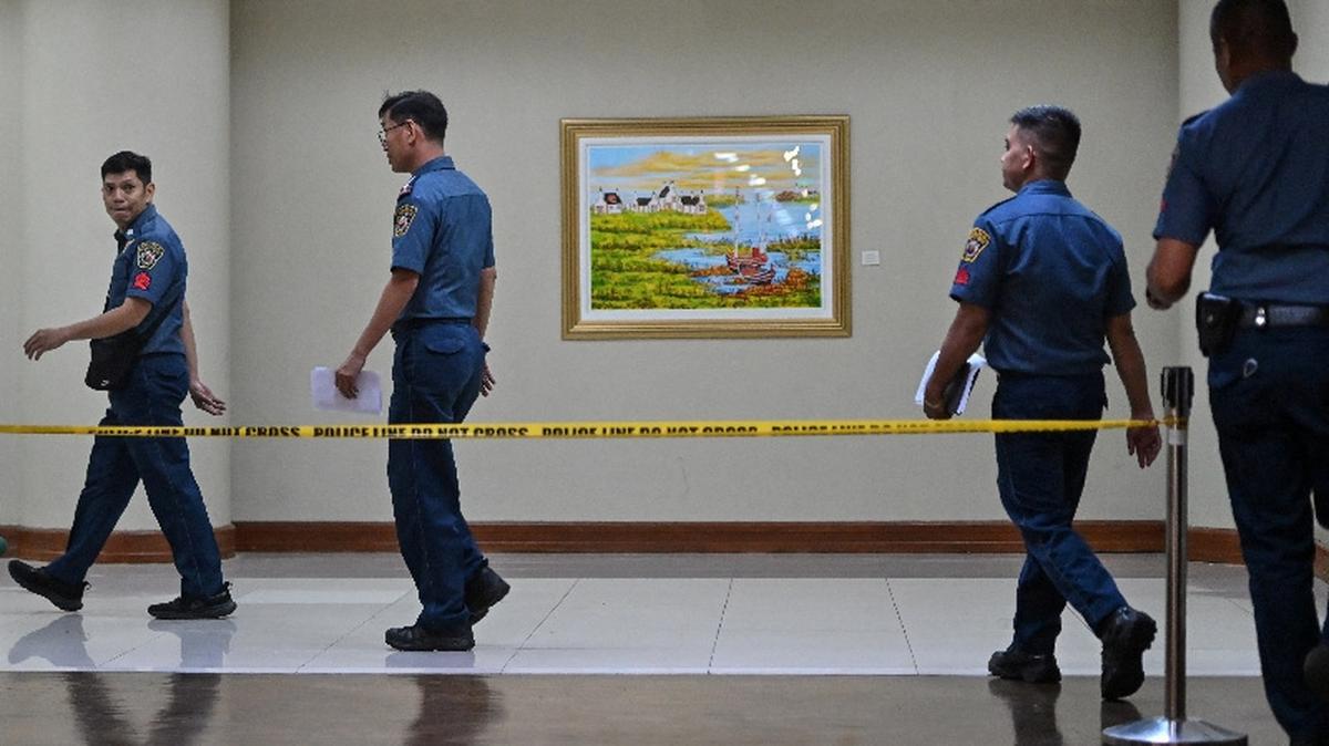 Policemen walk near the site where gunshots were heard at the Philippine Senate on Wednesday, in Pasay City, Metro Manila, Philippines, May 14, 2026. REUTERS/Noel Celios