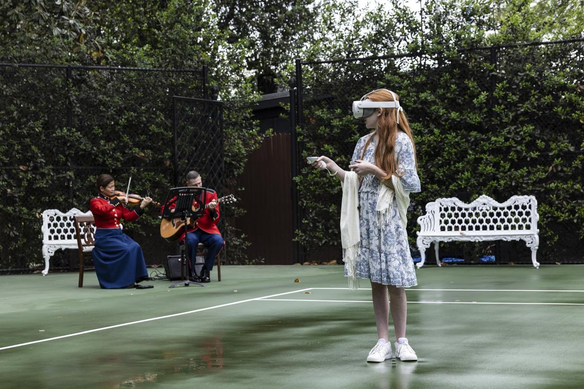 A student uses a Meta Quest VR headset as members of the U.S. Marine Band perform at an event hosted by fist lady Melania Trump for Queen Camilla on "exploring U.S.-U.K. History through Innovation" at the White House Tennis Pavilion at the White House campus in Washington, on Tuesday, April 28, 2026. (Anna Rose Layden/The New York Times)