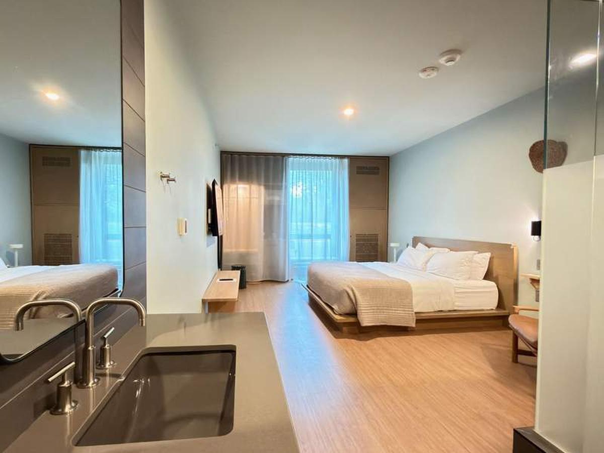  Calm and minimalist: The standard rooms focus on sleek, modern design, though storage space and traditional desks are intentionally traded for simplicity. Photo credit: Kim Orlando 