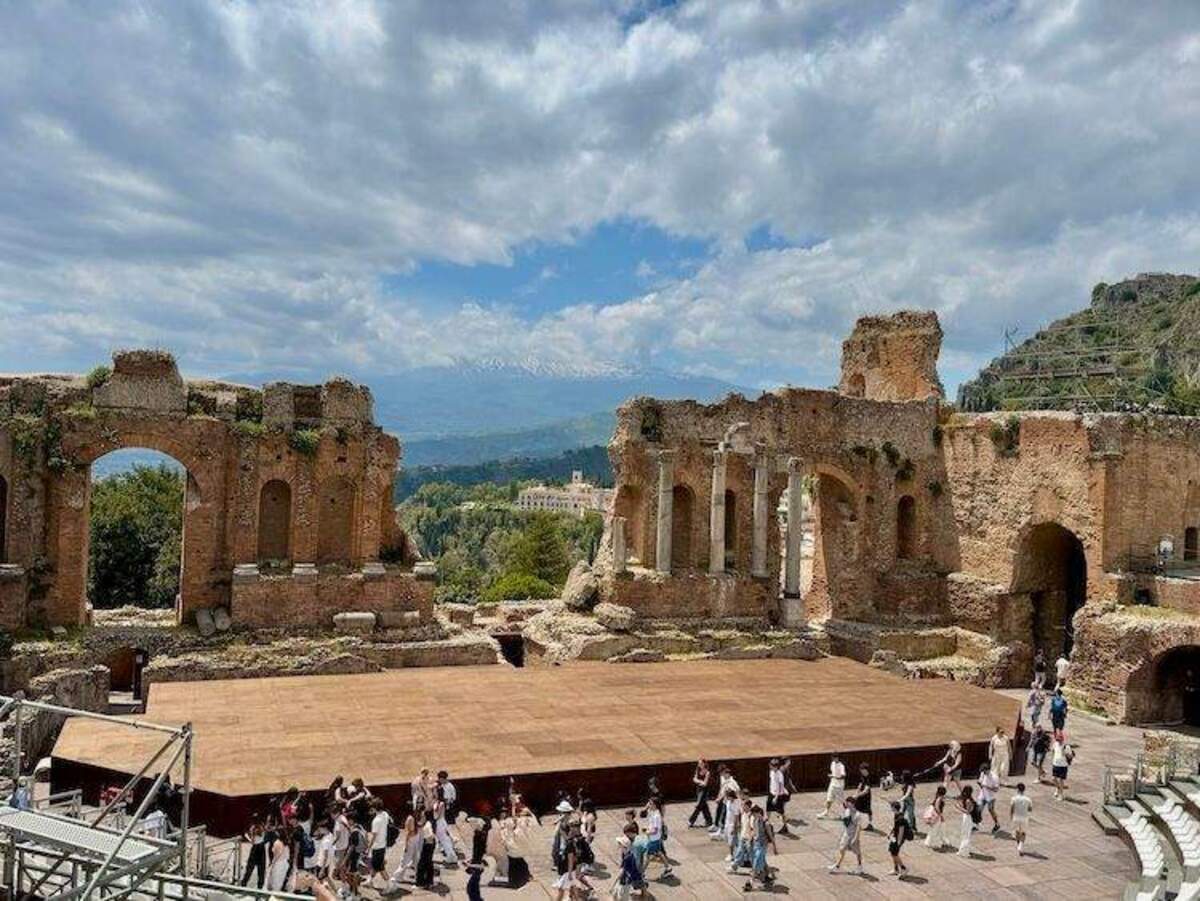  Standing among the ancient columns of Taormina's Greco-Roman theater, we looked out over the mountainside and felt the deep, slow rhythm of Mediterranean life. A shoulder-season voyage gives you the rare gift of time to let sights like this truly sink in. Photo credit: Sharon Kurtz 