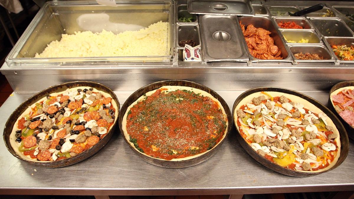 Deep dish pizzas are prepared at Connie's Pizza on March 6, 2008, in Chicago, Ill. Connie's Pizza makes thousands of pizzas each week.